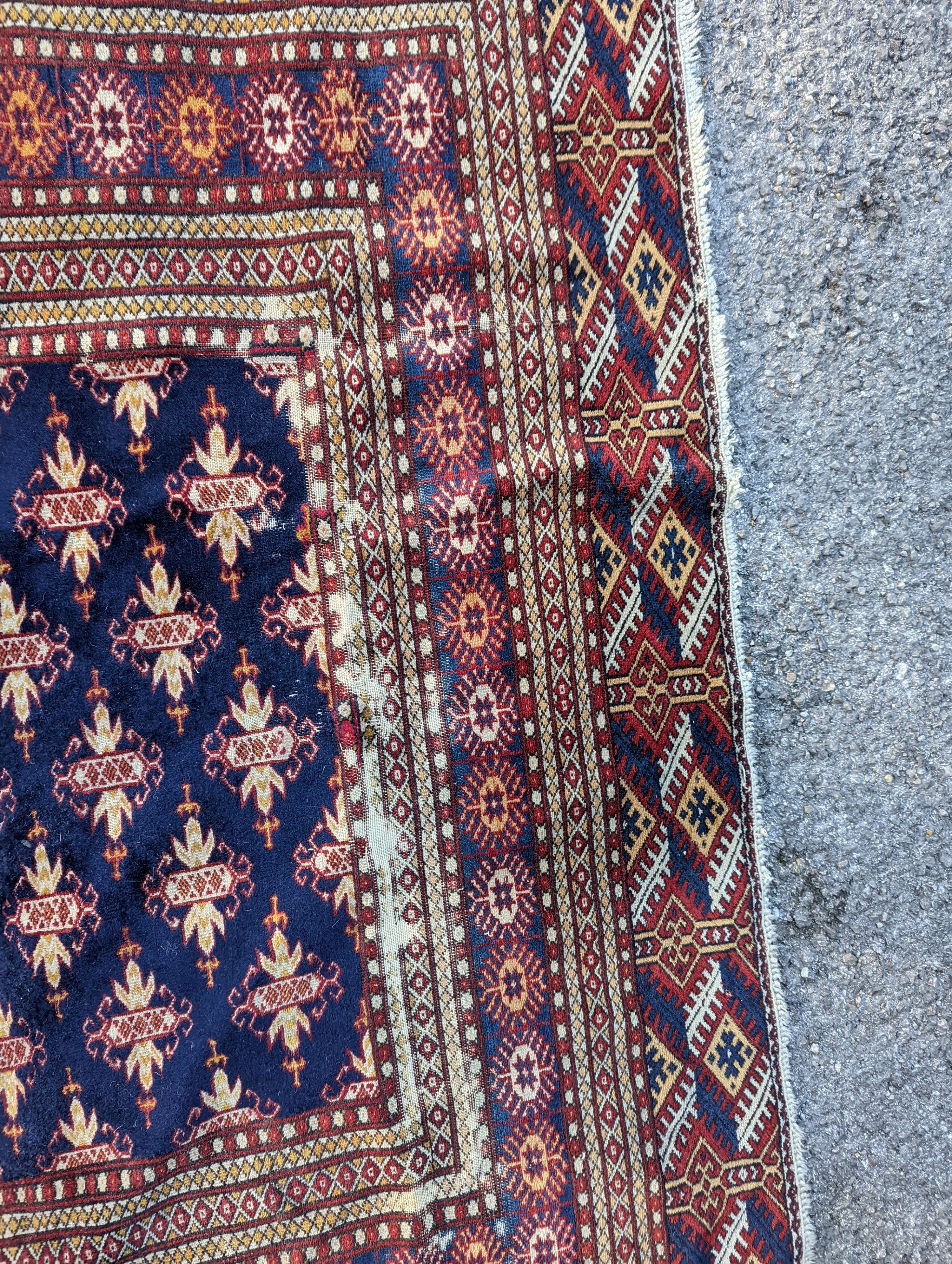 A Bokhara blue ground rug, 191 x 126cm